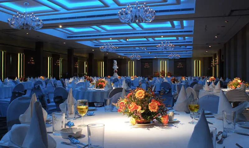 Romantic wedding reception with warm LED lighting and elegant decor